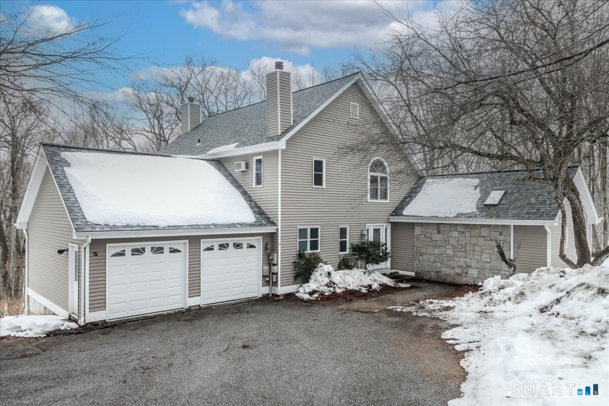8 Pebble Lane New Milford, CT 06776 - Photo 1 of 44 a view of a house with a snow in the yard