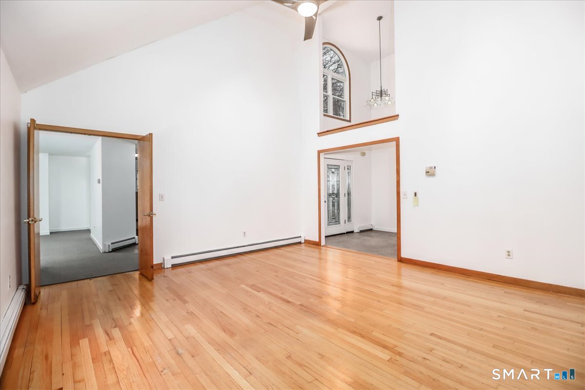 8 Pebble Lane New Milford, CT 06776 - Photo 12 of 44 a view of an empty room with wooden floor