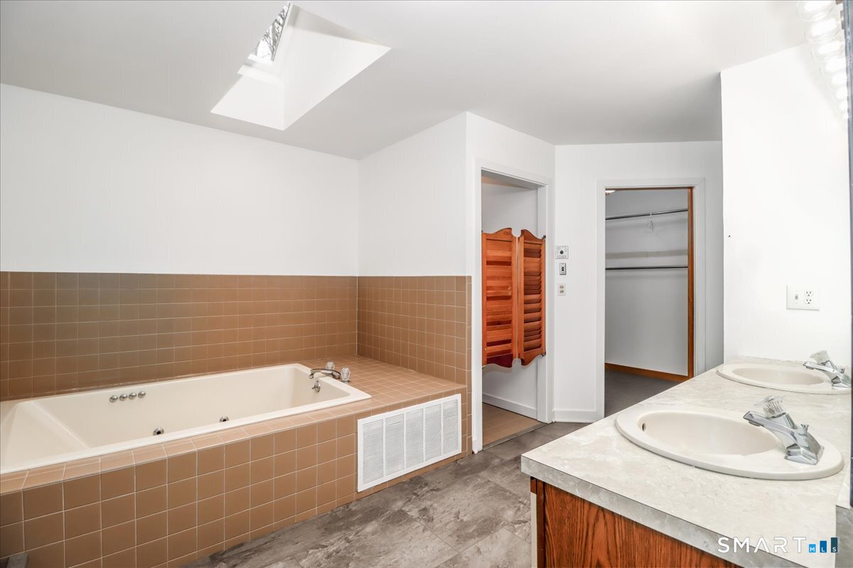 8 Pebble Lane New Milford, CT 06776 - Photo 19 of 44 a bathroom with a bathtub and a sink