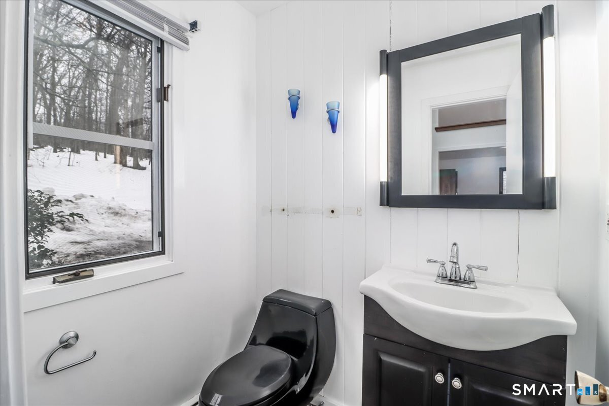 8 Pebble Lane New Milford, CT 06776 - Photo 20 of 44 a bathroom with a toilet a sink and mirror
