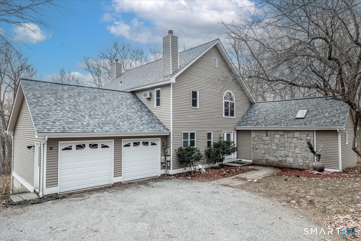 8 Pebble Lane New Milford, CT 06776 - Photo 2 of 44 a view of a house with a patio and backyard
