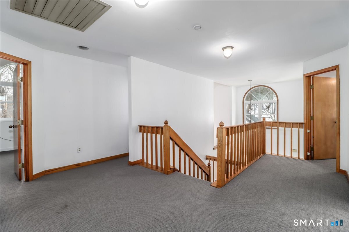 8 Pebble Lane New Milford, CT 06776 - Photo 24 of 44 a view of a hallway with windows