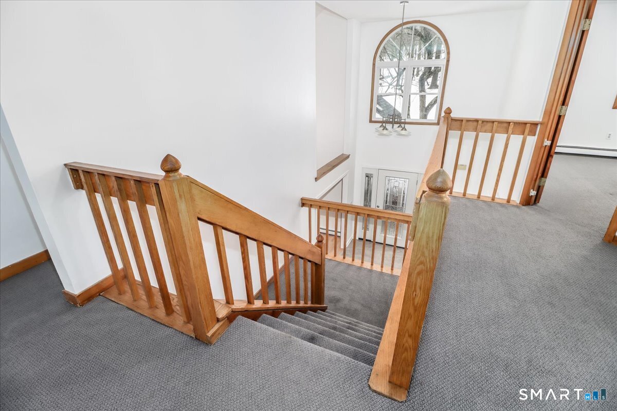 8 Pebble Lane New Milford, CT 06776 - Photo 25 of 44 a view of entryway with wooden floor