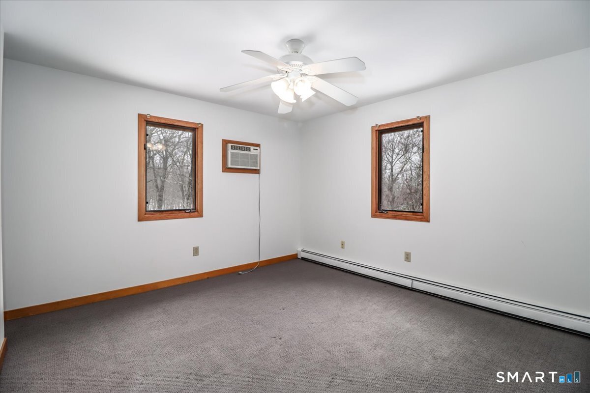 8 Pebble Lane New Milford, CT 06776 - Photo 26 of 44 a view of an empty room with window