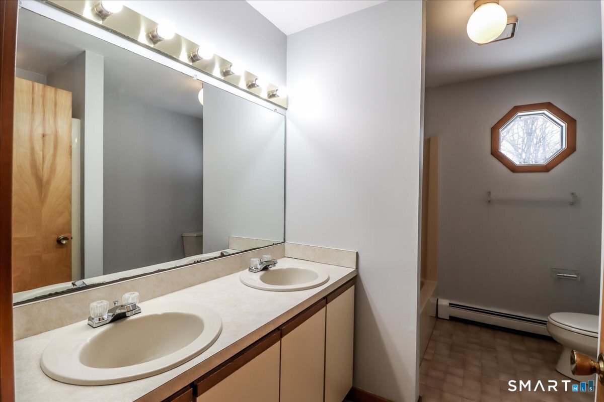 8 Pebble Lane New Milford, CT 06776 - Photo 34 of 44 a bathroom with a sink and a mirror