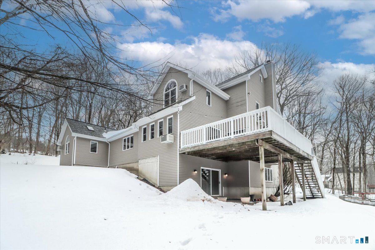 8 Pebble Lane New Milford, CT 06776 - Photo 38 of 44 a view of a house with a snow in the background