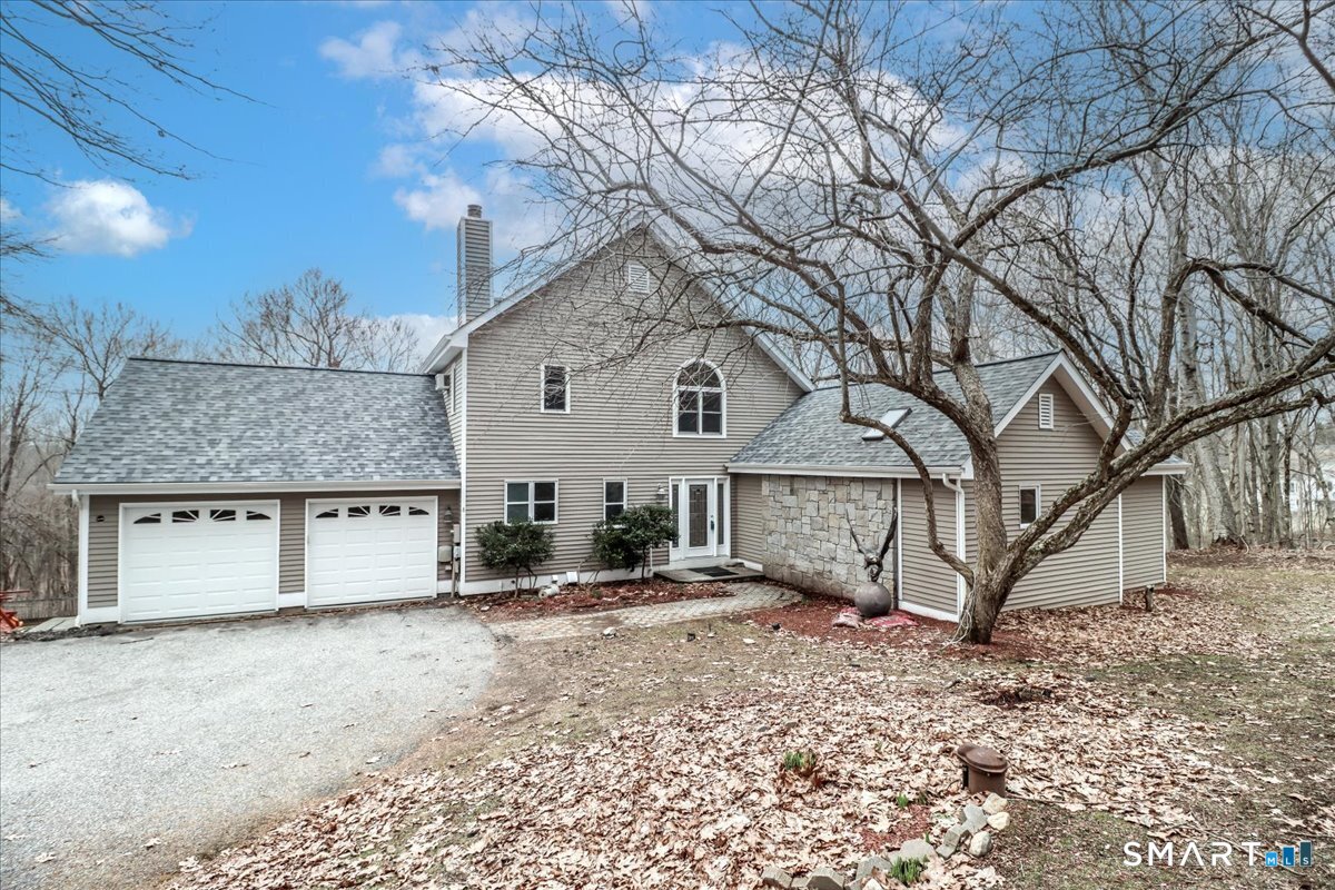 8 Pebble Lane New Milford, CT 06776 - Photo 39 of 44 a view of a house with a yard and a tree
