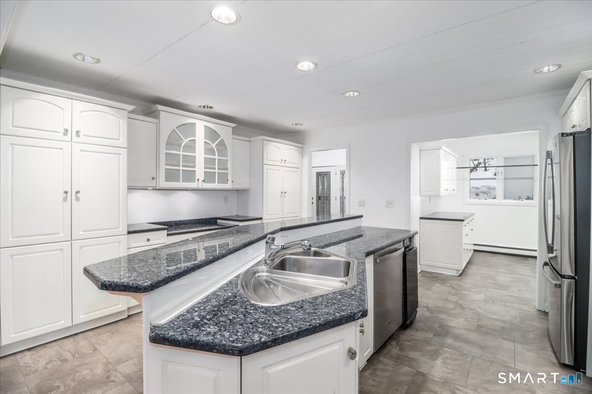 8 Pebble Lane New Milford, CT 06776 - Photo 4 of 44 a kitchen with stainless steel appliances granite countertop a sink stove and refrigerator