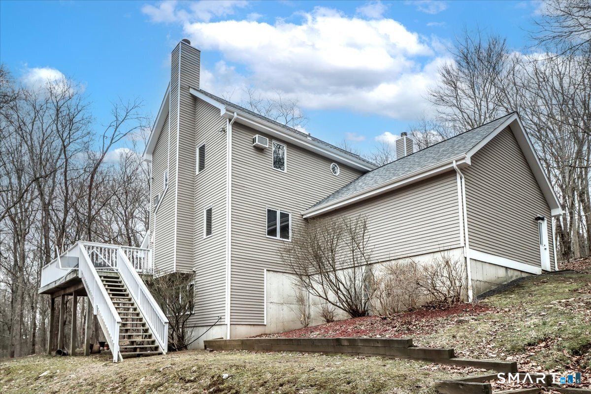 8 Pebble Lane New Milford, CT 06776 - Photo 42 of 44 a view of a house with a wooden fence