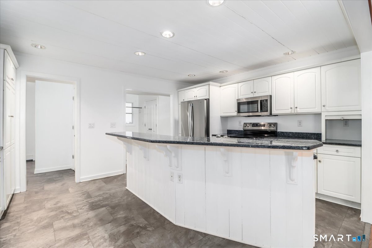 8 Pebble Lane New Milford, CT 06776 - Photo 5 of 44 a view of a kitchen with electric appliances