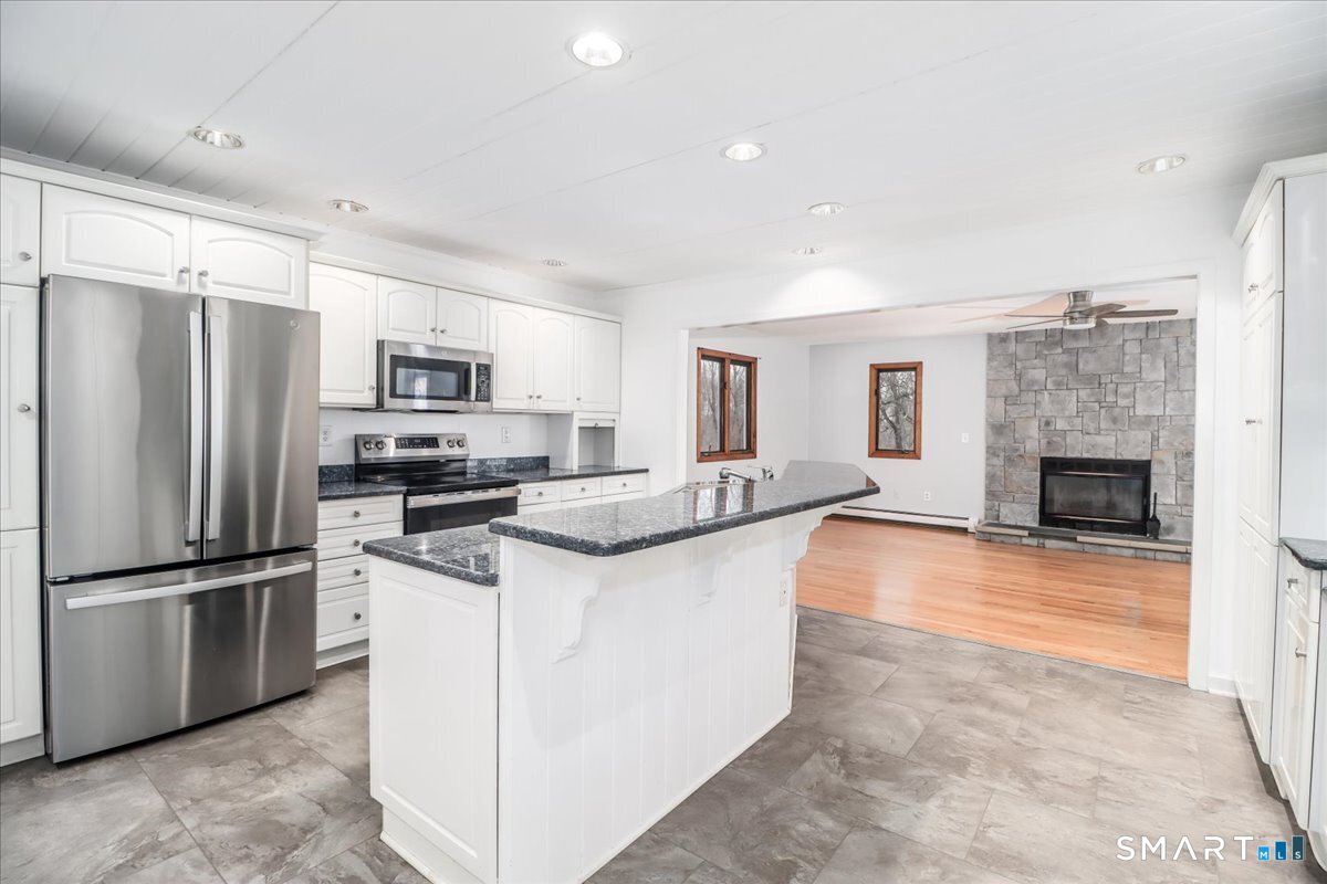 8 Pebble Lane New Milford, CT 06776 - Photo 6 of 44 a kitchen with stainless steel appliances a refrigerator sink and microwave