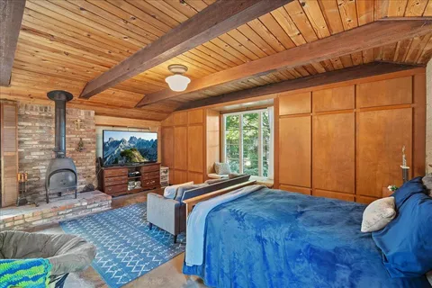 a living room with furniture a rug and a ceiling fan