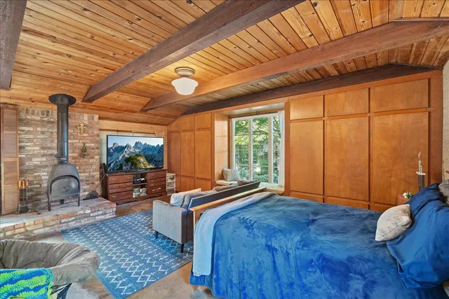 a living room with furniture a rug and a ceiling fan