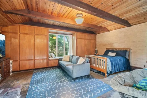 a bedroom with a bed and a dresser