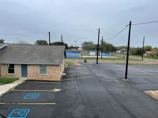 wooden floor and window in an empty room