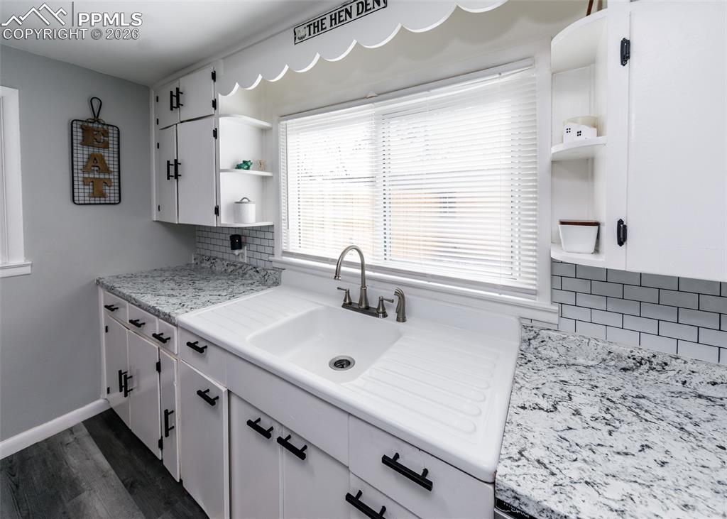 548 Denver Street Calhan, CO 80808 - Photo 12 of 40 a bathroom with a sink a vanity and a large mirror