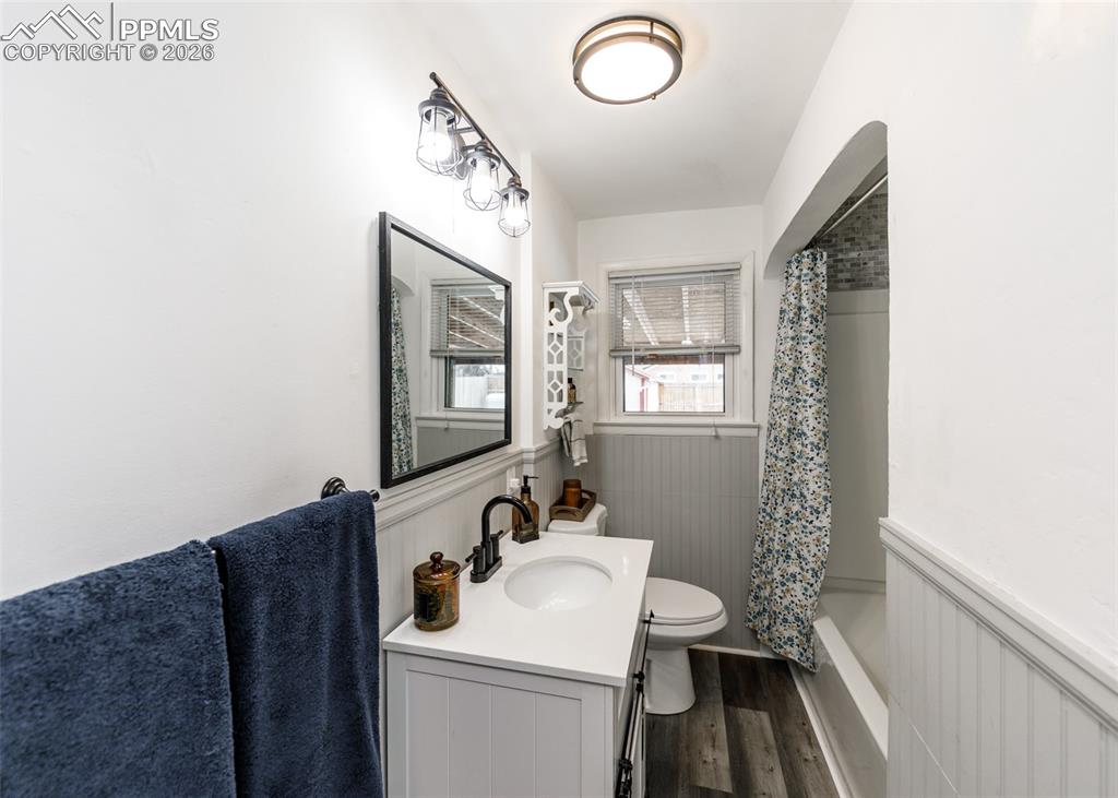 548 Denver Street Calhan, CO 80808 - Photo 22 of 40 a bathroom with a sink a toilet and mirror