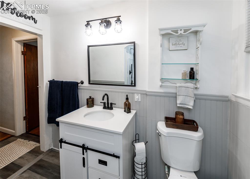 548 Denver Street Calhan, CO 80808 - Photo 23 of 40 a bathroom with a sink a toilet and mirror
