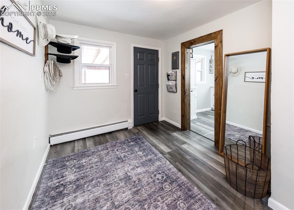 548 Denver Street Calhan, CO 80808 - Photo 25 of 40 a view of a closet area with wooden floor