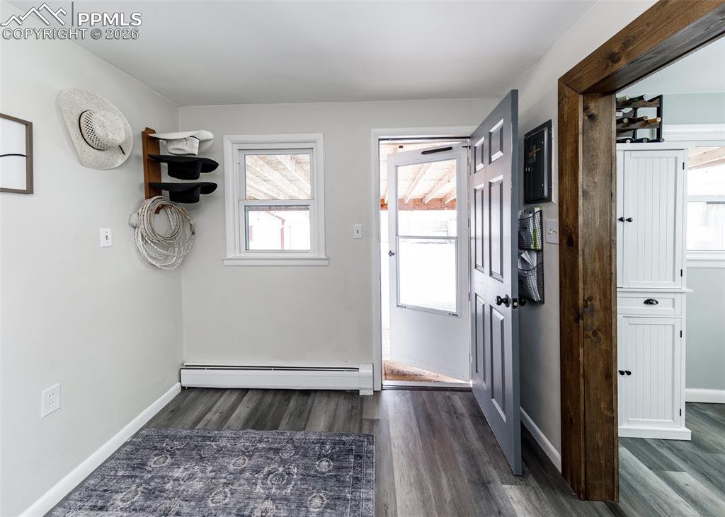 548 Denver Street Calhan, CO 80808 - Photo 27 of 40 a view of empty room with window and wooden floor
