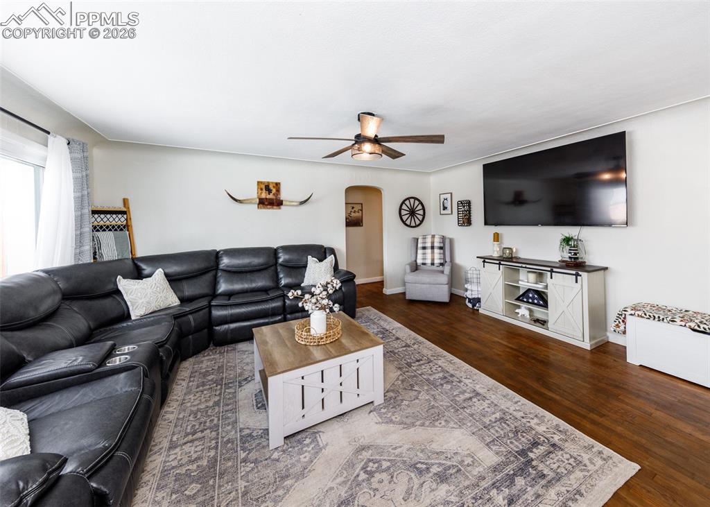 548 Denver Street Calhan, CO 80808 - Photo 3 of 40 a living room with furniture and a flat screen tv