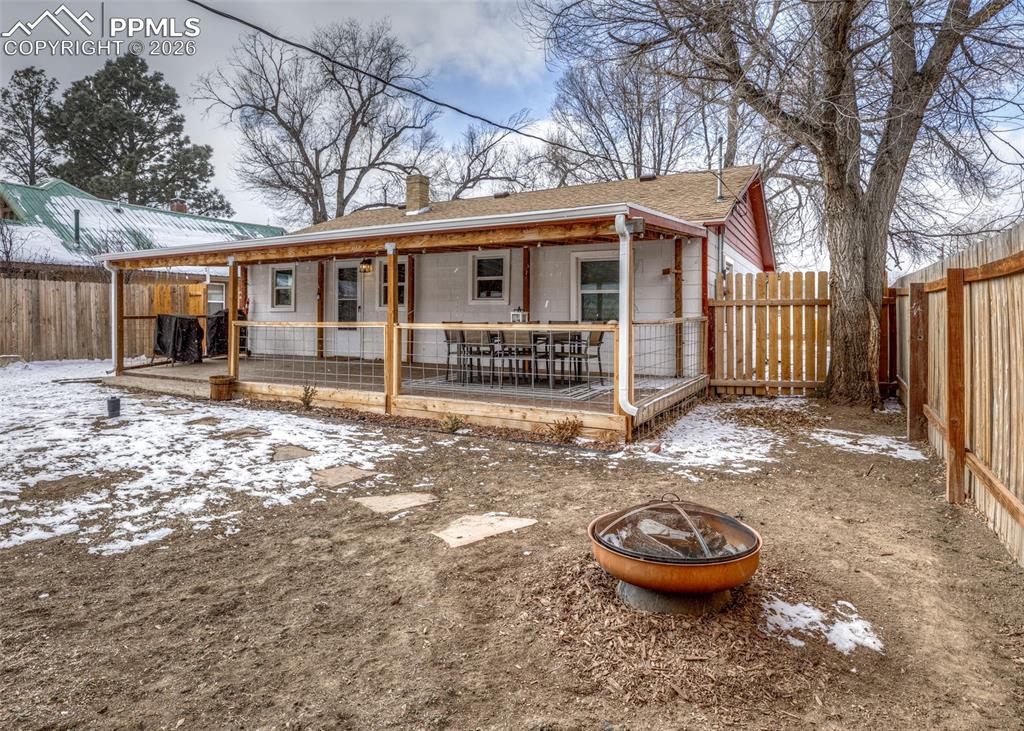 548 Denver Street Calhan, CO 80808 - Photo 35 of 40 a view of a house with backyard and chairs