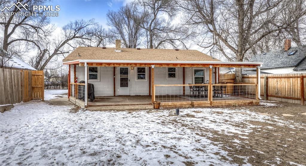548 Denver Street Calhan, CO 80808 - Photo 36 of 40 a house with trees in front of it