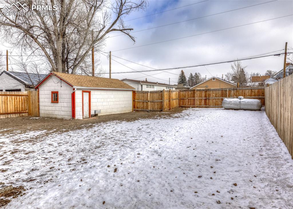 548 Denver Street Calhan, CO 80808 - Photo 38 of 40 a view of a large house with a yard and large tree