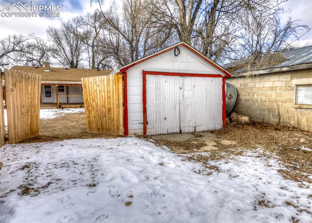 548 Denver Street Calhan, CO 80808 - Photo 39 of 40 a front view of a house with a yard and garage