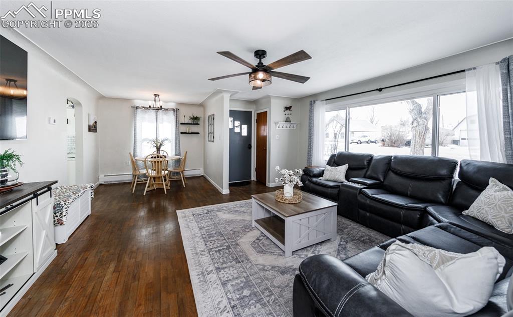 548 Denver Street Calhan, CO 80808 - Photo 5 of 40 a living room with furniture and a large window