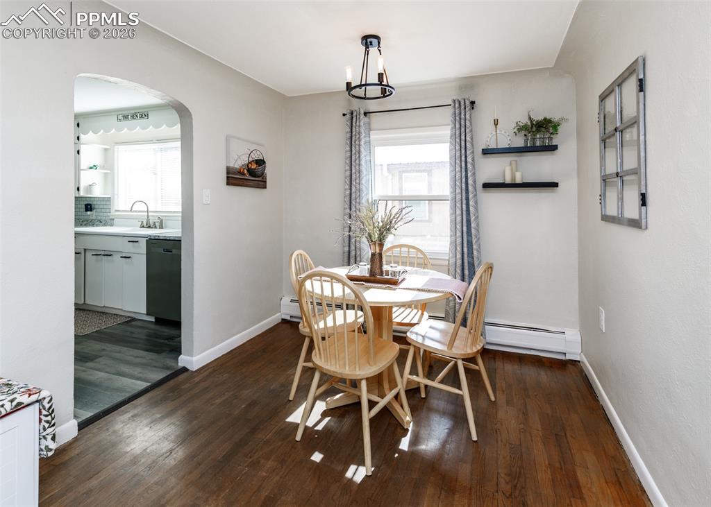 548 Denver Street Calhan, CO 80808 - Photo 8 of 40 a view of a dining room with furniture window and wooden floor
