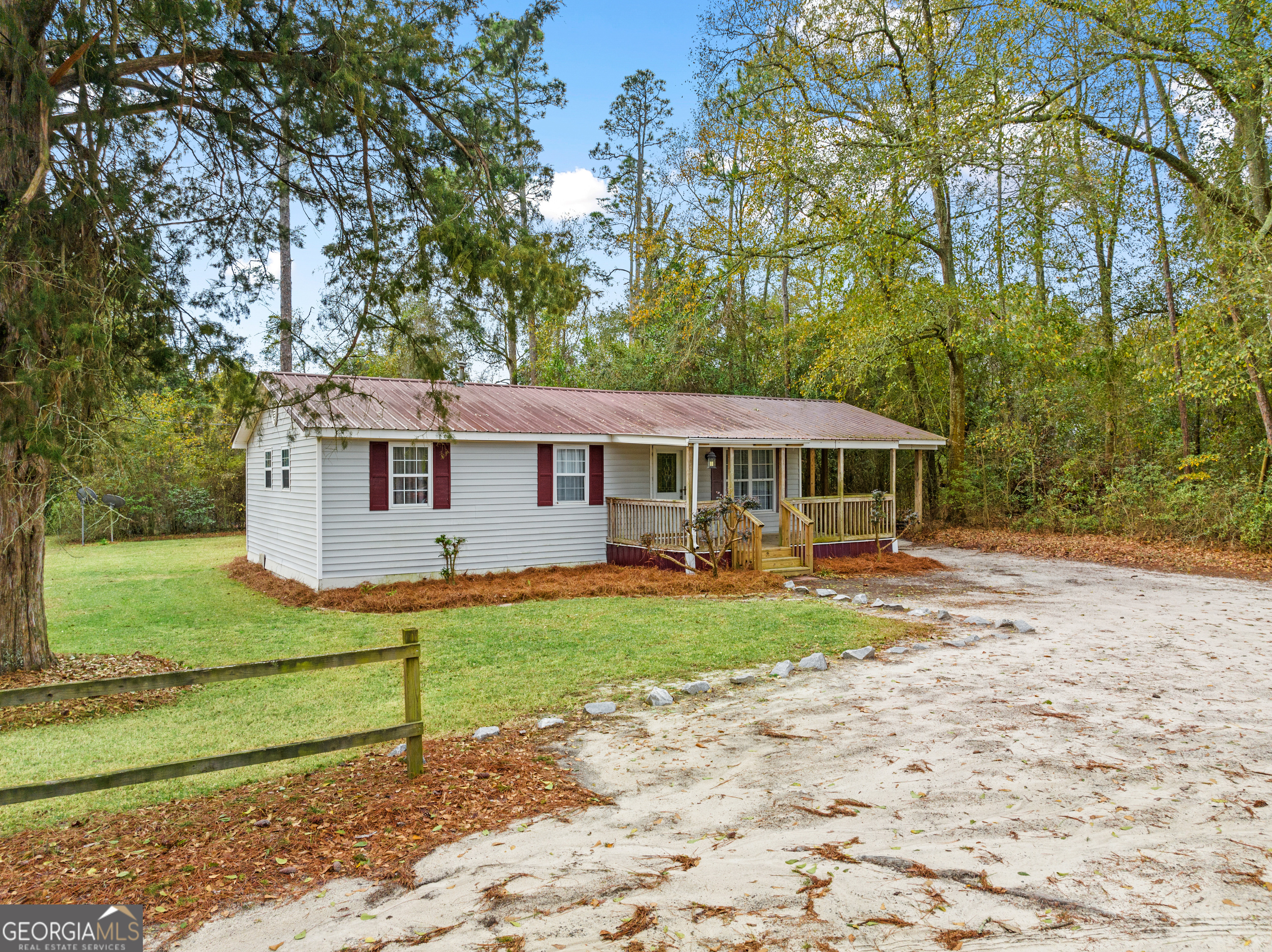 1416 County Line Road Camilla, GA 31730 - Photo 1 of 1 a front view of a house with yard patio and green space