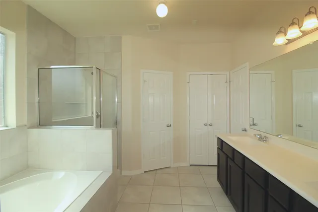 a bathroom with a bathtub and a sink