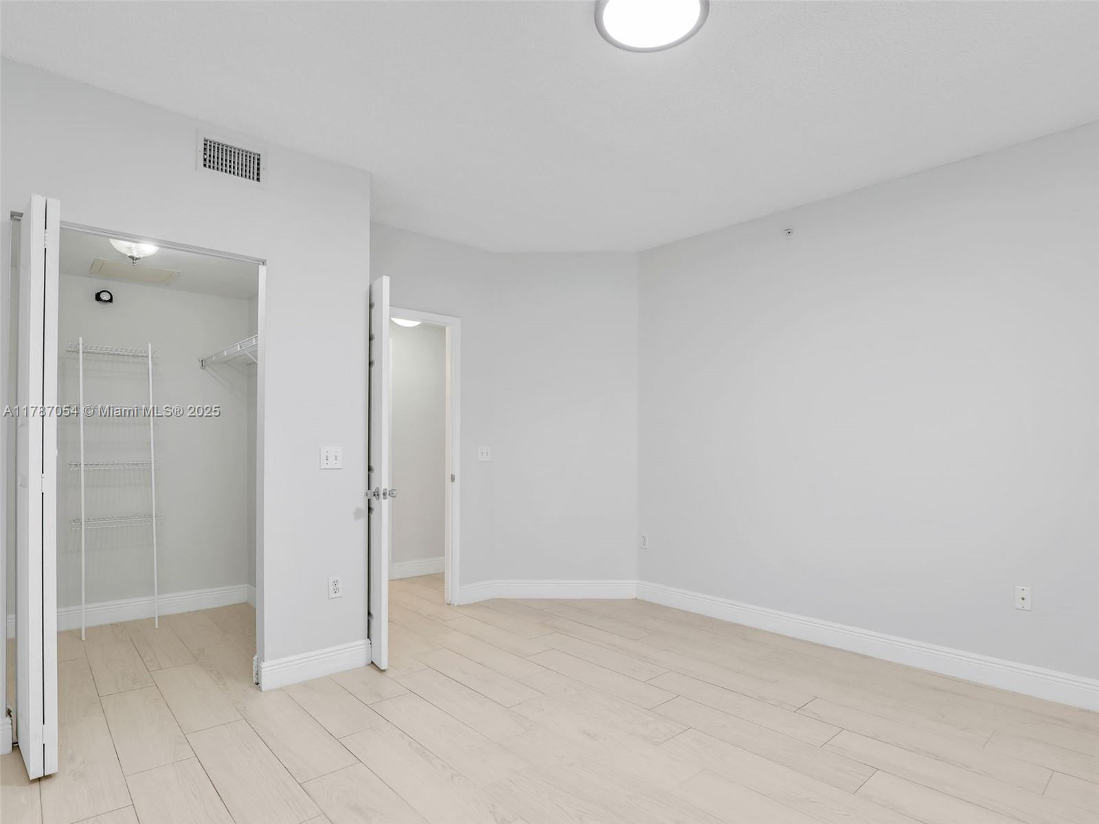 1235 Reserve Way, Unit 5107 Naples, FL 34105 - Photo 13 of 27 a view of an empty room