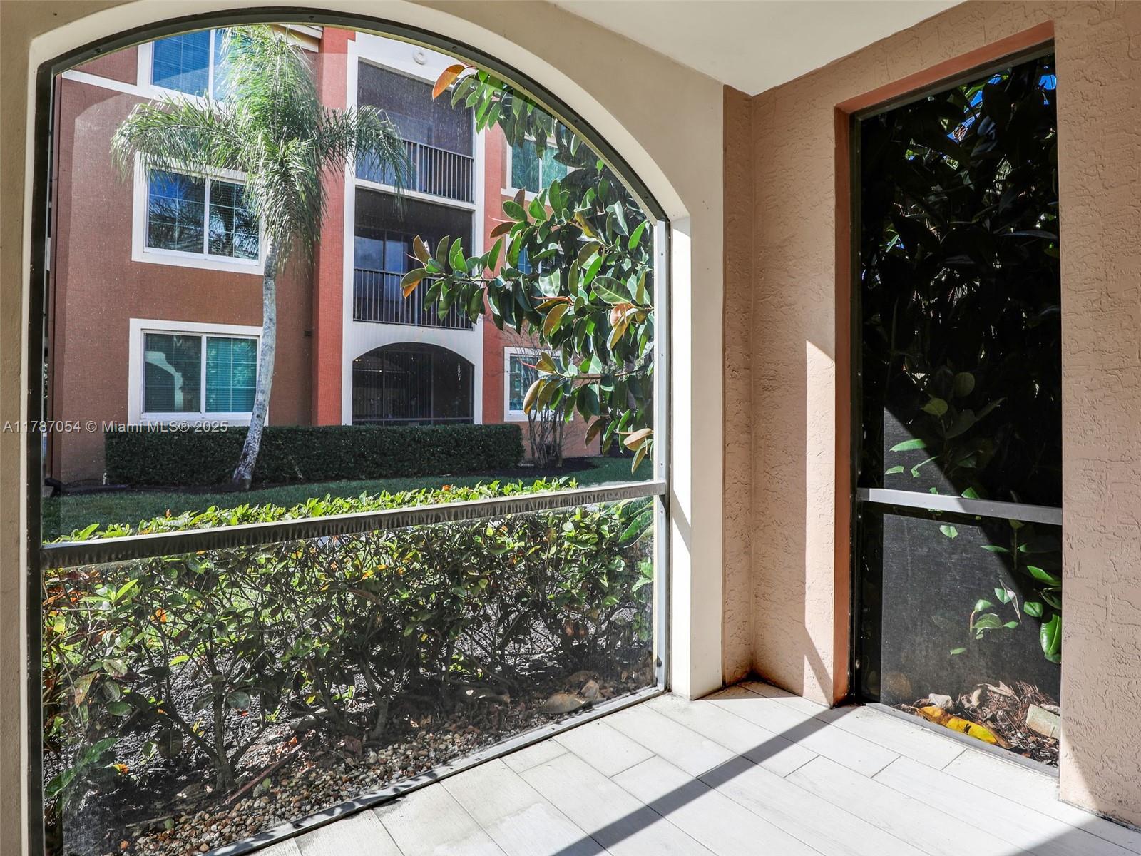 1235 Reserve Way, Unit 5107 Naples, FL 34105 - Photo 17 of 27 a front view of a house with a yard