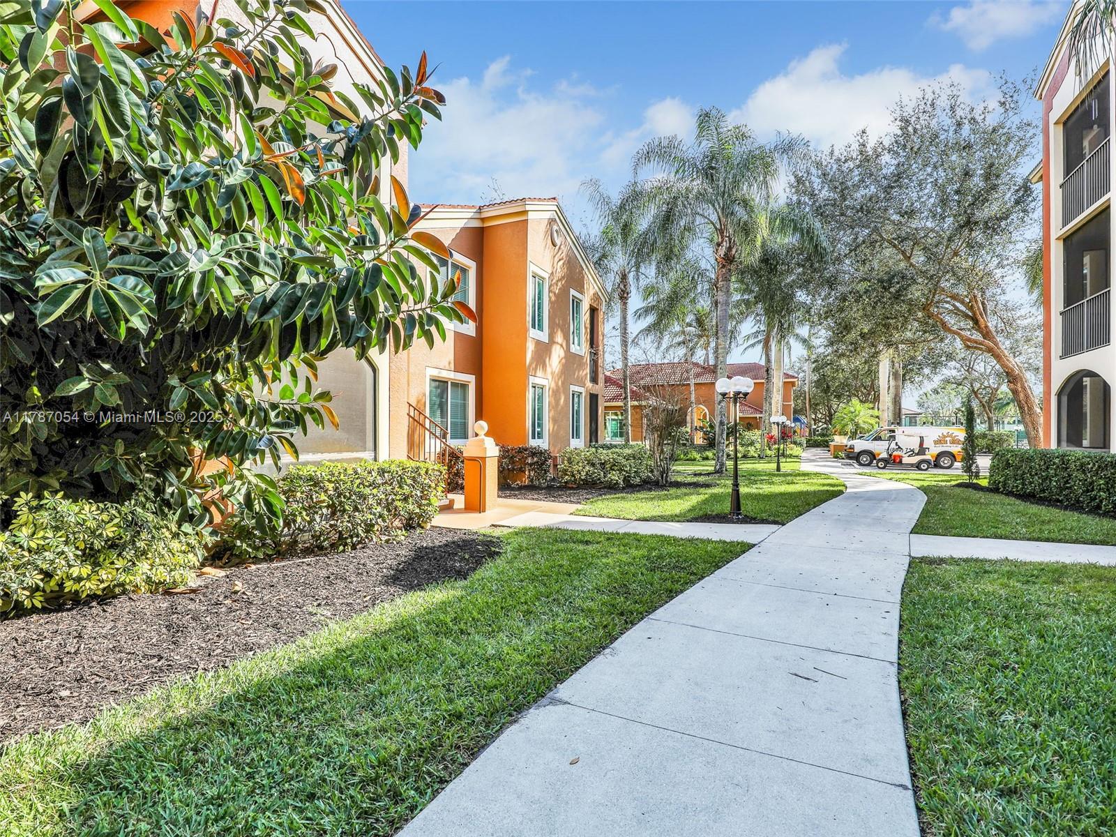 1235 Reserve Way, Unit 5107 Naples, FL 34105 - Photo 18 of 27 a view of a park with plants and trees