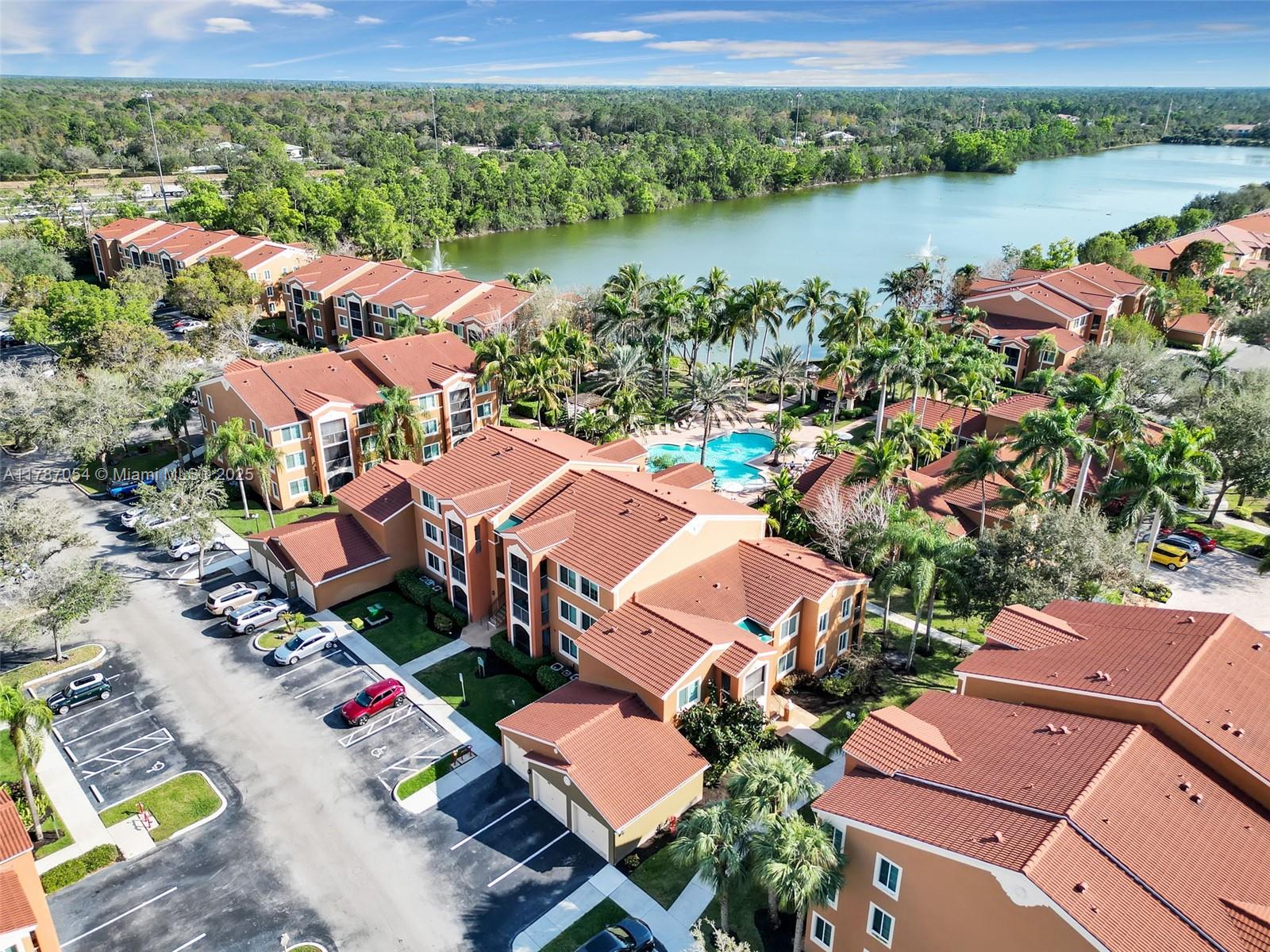 1235 Reserve Way, Unit 5107 Naples, FL 34105 - Photo 22 of 27 an aerial view of residential houses with outdoor space and river