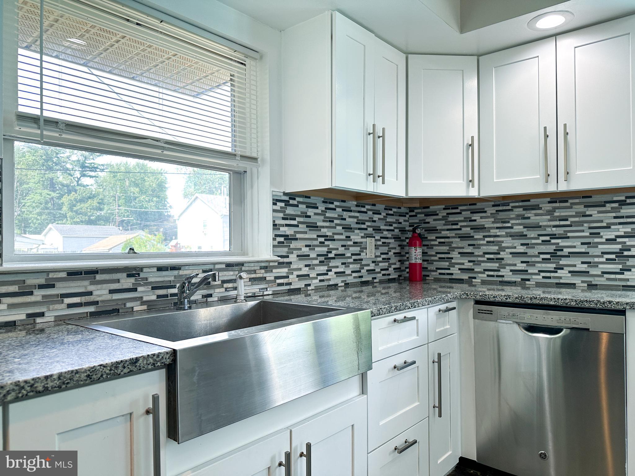 2191 Dunks Ferry Road Bensalem, PA 19020 - Photo 17 of 33 a kitchen with granite countertop a sink and a window