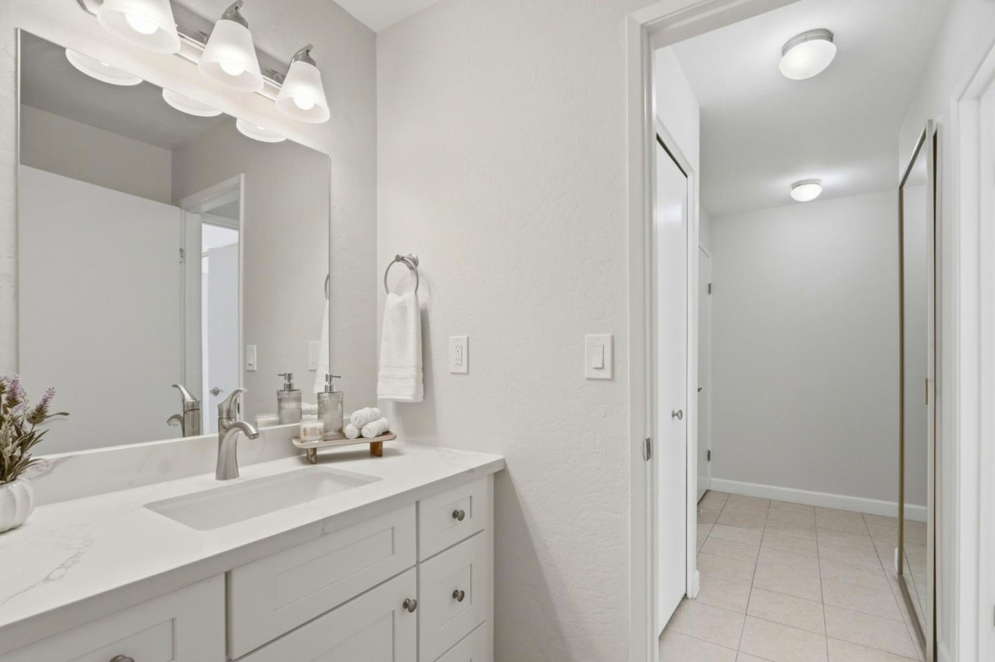2252 Almaden Road, Unit A San Jose, CA 95125 - Photo 20 of 40 a bathroom with a double vanity sink and a mirror