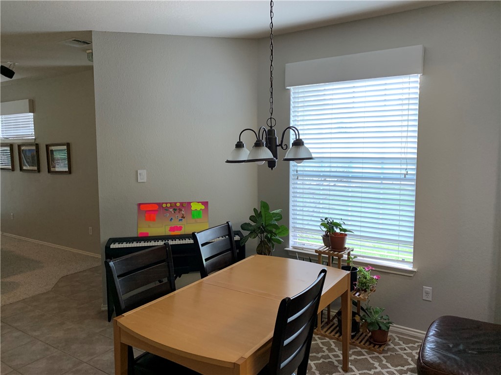 1900 Scofield Ridge Parkway, Unit 1202 Austin, TX 78727 - Photo 5 of 18 Dining area with window to side yard