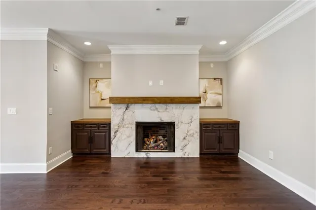 a view of a dining room with furniture wooden floor and chandelier