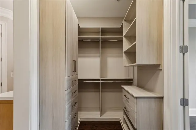 a bathroom with a granite countertop sink a toilet and a shower