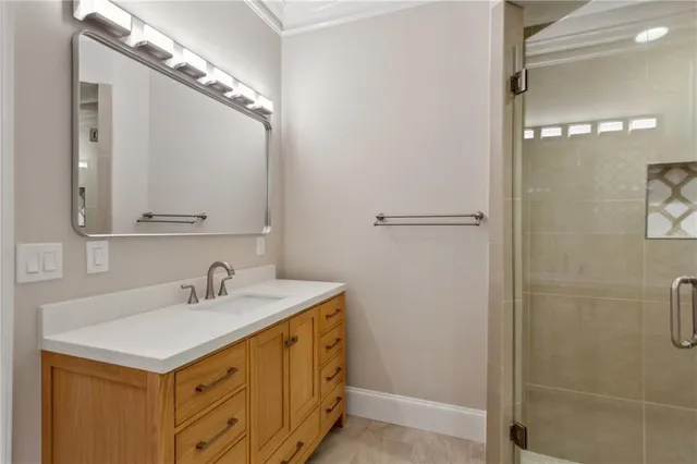 a view of a hallway with wooden floor and stairs