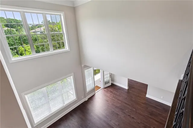 a living room with furniture and stairs
