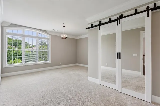 a living room with furniture cabinets and a book shelf