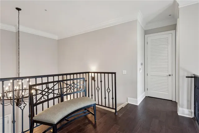 a view of a hallway with wooden shelves
