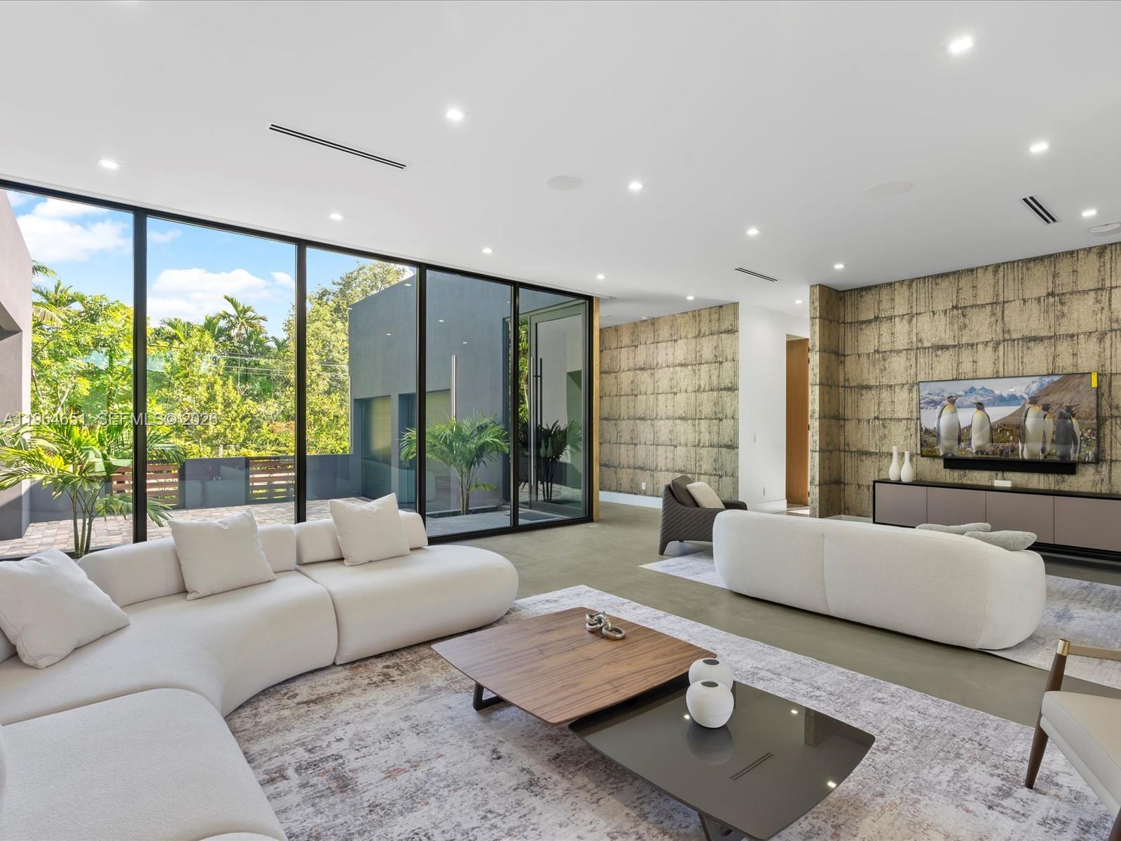 871 Northeast 83rd Street Miami, FL 33138 - Photo 17 of 54 a living room with furniture and a large window