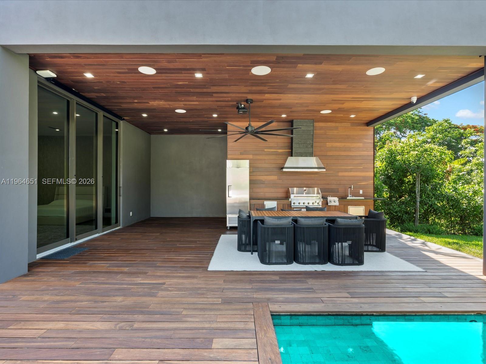 871 Northeast 83rd Street Miami, FL 33138 - Photo 23 of 54 a view of a swimming pool with a patio