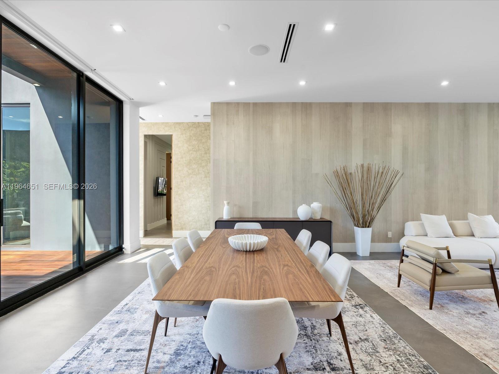 871 Northeast 83rd Street Miami, FL 33138 - Photo 32 of 54 a living room with furniture and a table