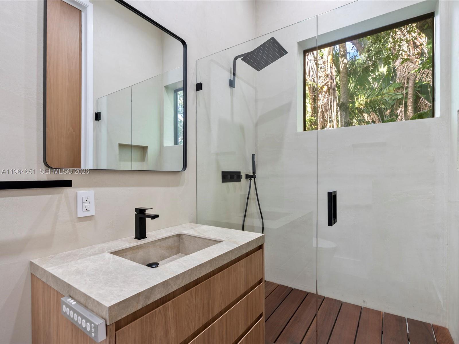 871 Northeast 83rd Street Miami, FL 33138 - Photo 45 of 54 a bathroom with a sink and a mirror
